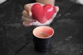 Hand-holding red heart on the coffee cup, Ã¢â¬â¹love a coffee concept, promotion Royalty Free Stock Photo